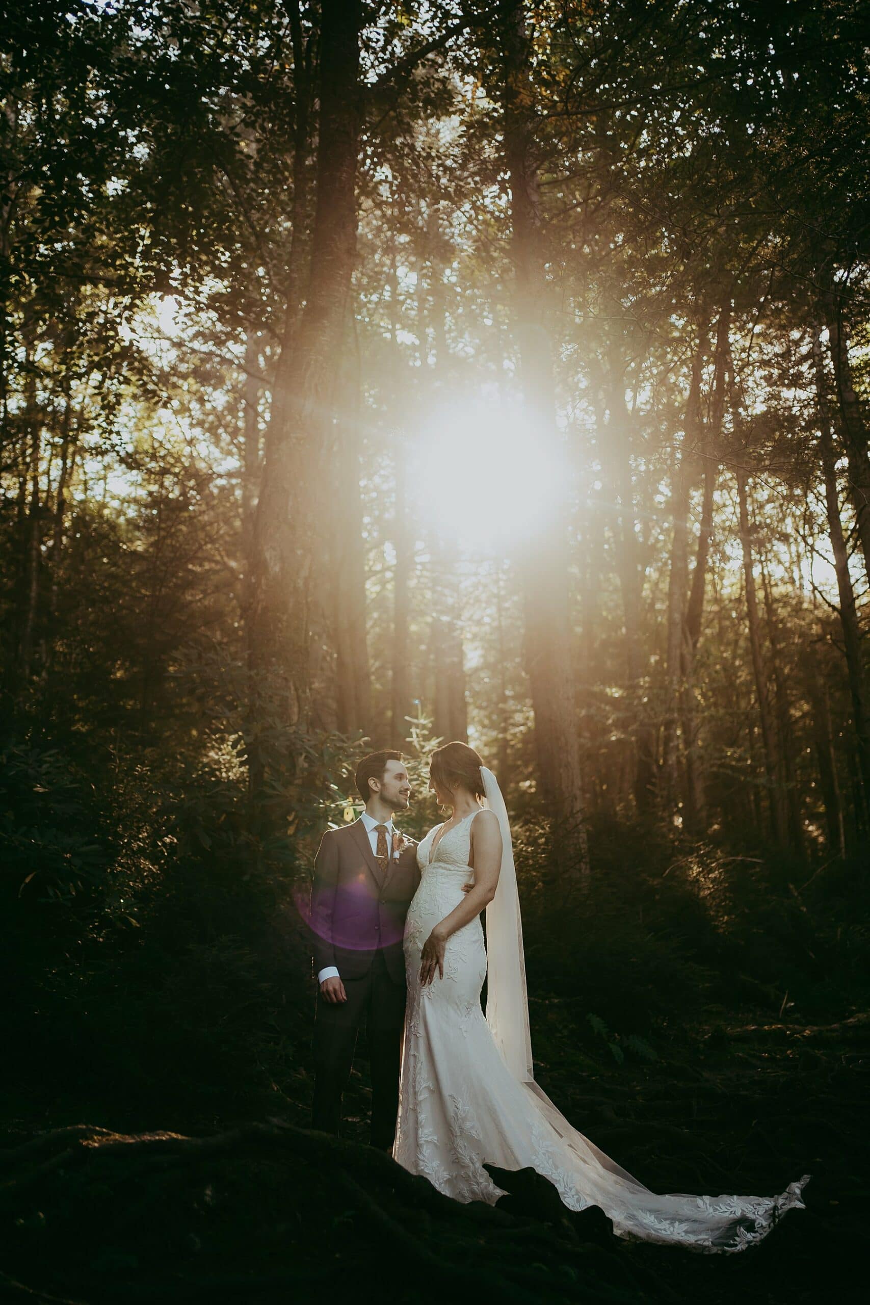 Intimate wedding couple hugging near the falls at blackwater falls, wv
